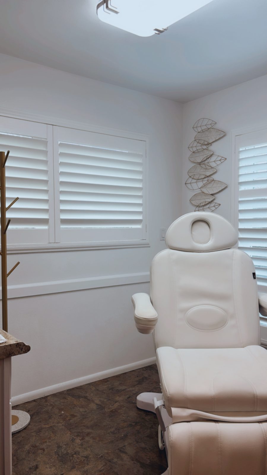 A bright, private medical aesthetics treatment room in the Hilo office